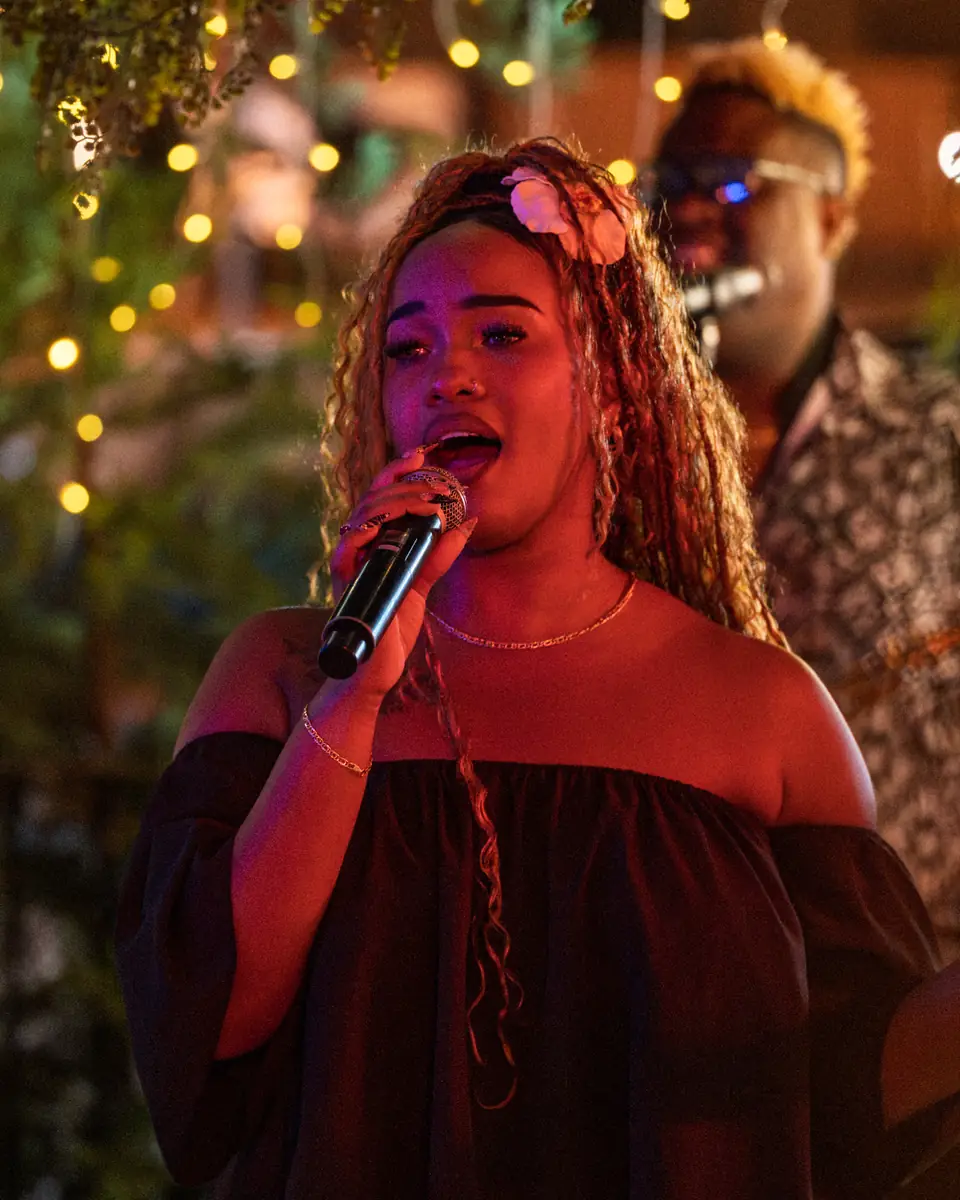 A vocalist mid-phrase on the Pachamama terrace